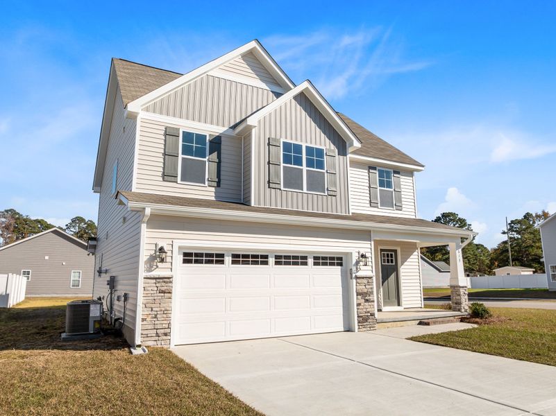Front exterior of a new home in Arbor Hills South, Greenville, NC, highlighting curb appeal (Image 19).