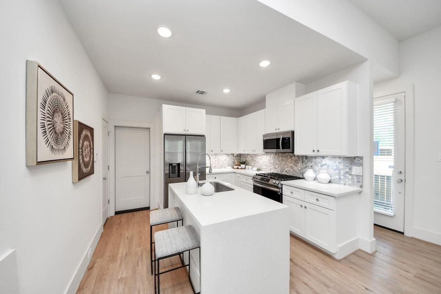 Sleek kitchen featuring stainless steel appliances. Sleek kitchen featuring stainless steel appliances.