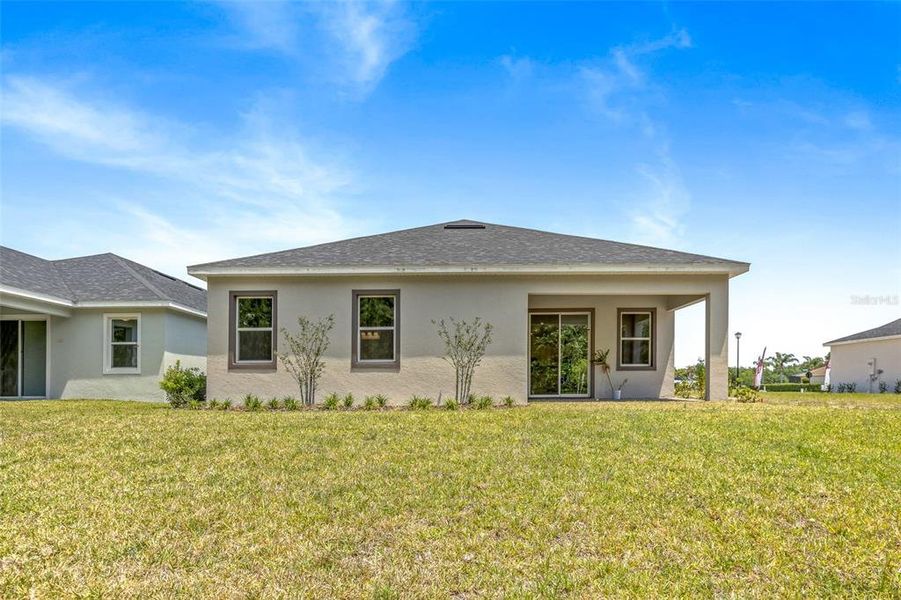 Exterior details and patio area of a home in Gray Hawk at Hole Two, Daytona Beach (Image 24).