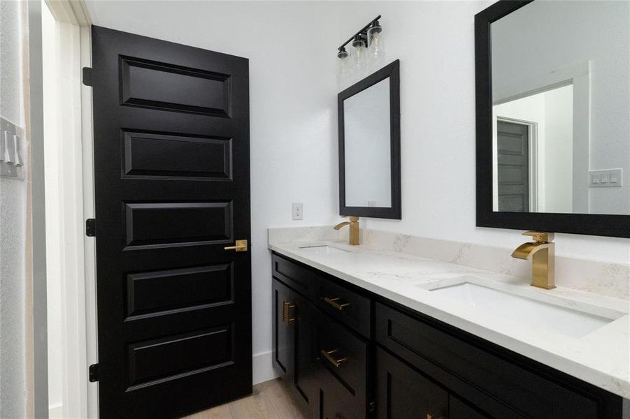 Bathroom with vanity and hardwood / wood-style flooring