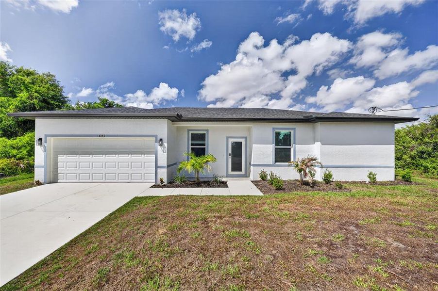Front exterior of a new home in , Port Charlotte, FL, highlighting curb appeal (Image 2). Front exterior of a new home in , Port Charlotte, FL, highlighting curb appeal (Image 2).