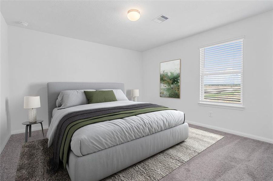 Secondary bedroom features plush carpet, neutral paint, lighting, large window with privacy blinds and ample sized closet space.