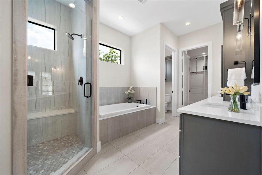 Melt away your stress in the deep soaking tub and oversized double head shower.