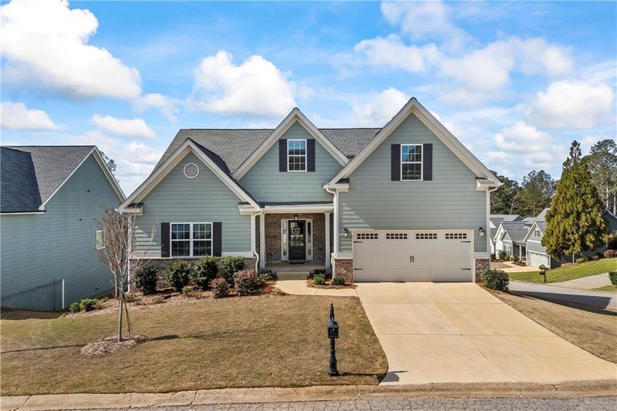 Front exterior of a new home in Traditions of Braselton, Jefferson, GA, highlighting curb appeal (Image 25). Front exterior of a new home in Traditions of Braselton, Jefferson, GA, highlighting curb appeal (Image 25).