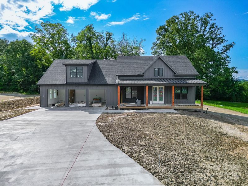 Front exterior of a new home in , Mills River, NC, highlighting curb appeal (Image 14).