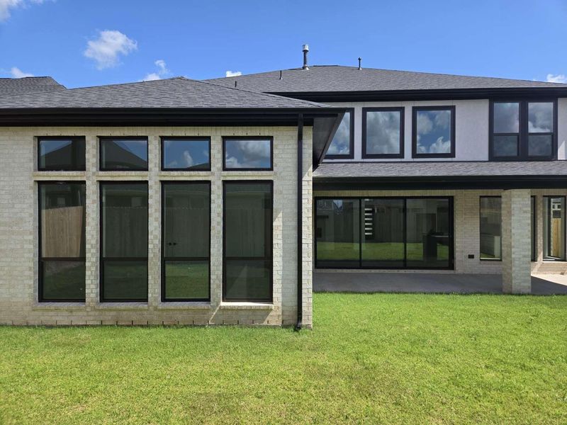 Front exterior of a new home in , Richmond, TX, highlighting curb appeal (Image 1).