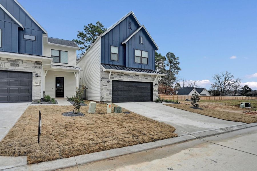 Front exterior of a new home in Summer Place  35', Montgomery, TX, highlighting curb appeal (Image 27).