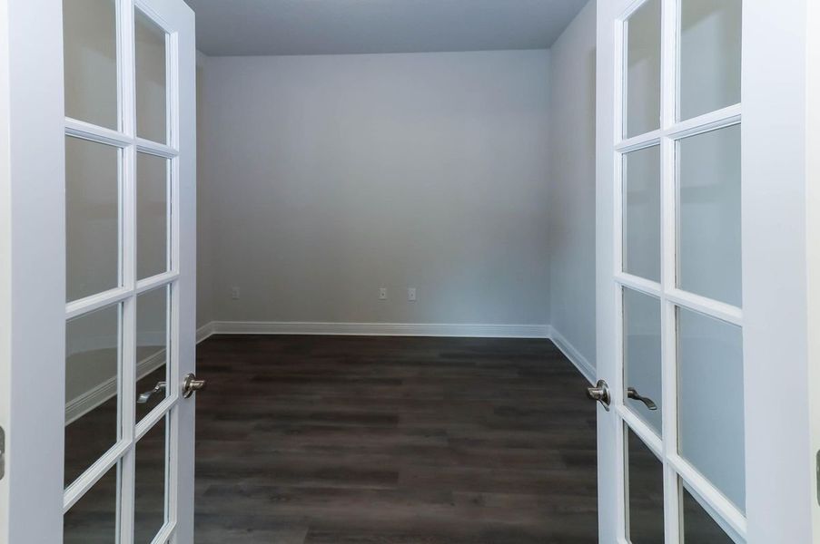 Representative unfurnished interior of a home built from the Plan 3044 by Adams Homes in Cedar Creek at Deerpoint Lake, Panama City (Image 11).