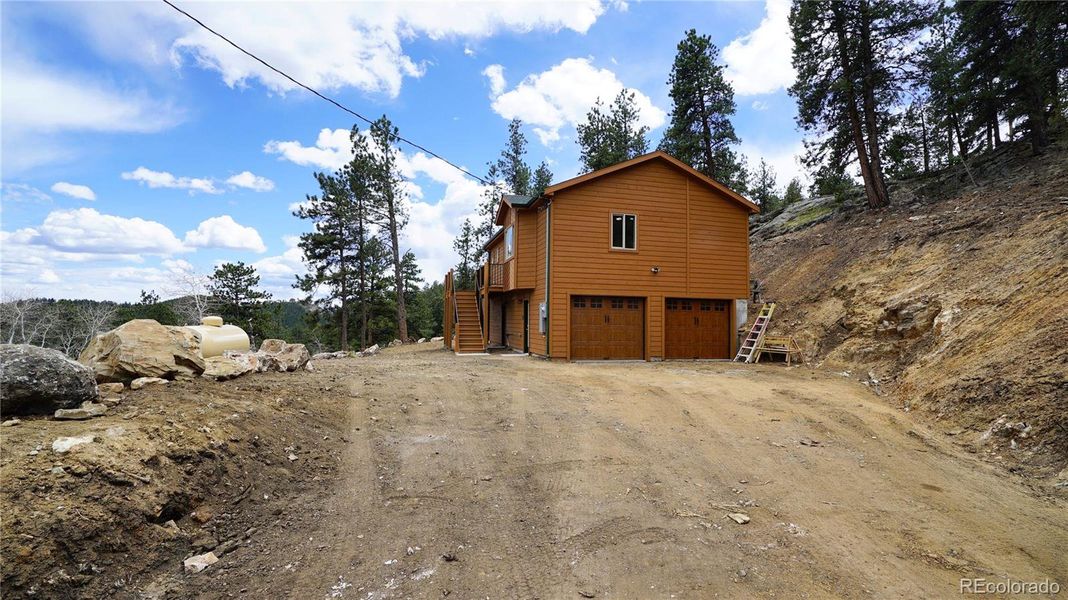 Front exterior of a new home in , Bailey, CO, highlighting curb appeal (Image 14). Front exterior of a new home in , Bailey, CO, highlighting curb appeal (Image 14).