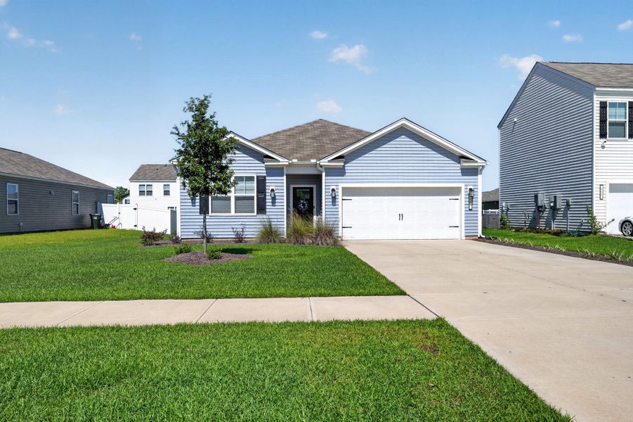 Front exterior of a new home in Carolina Groves, Moncks Corner, SC, highlighting curb appeal (Image 19).