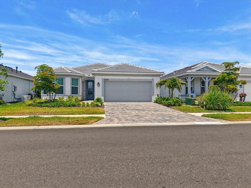 Front exterior of a new home in , Englewood, FL, highlighting curb appeal (Image 28). Front exterior of a new home in , Englewood, FL, highlighting curb appeal (Image 28).