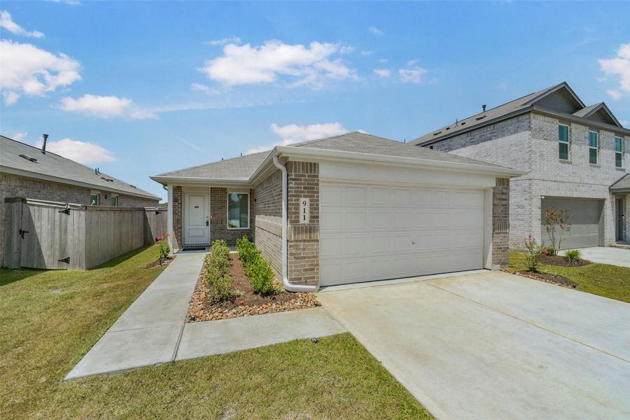 Front exterior of a new home in Sila, Huffman, TX, highlighting curb appeal (Image 25). Front exterior of a new home in Sila, Huffman, TX, highlighting curb appeal (Image 25).