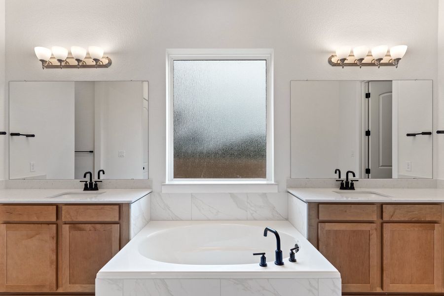 Representative furnished interior of a home built from the Waterville by Ashton Woods in The Trails at Carmel, Pflugerville (Image 10).