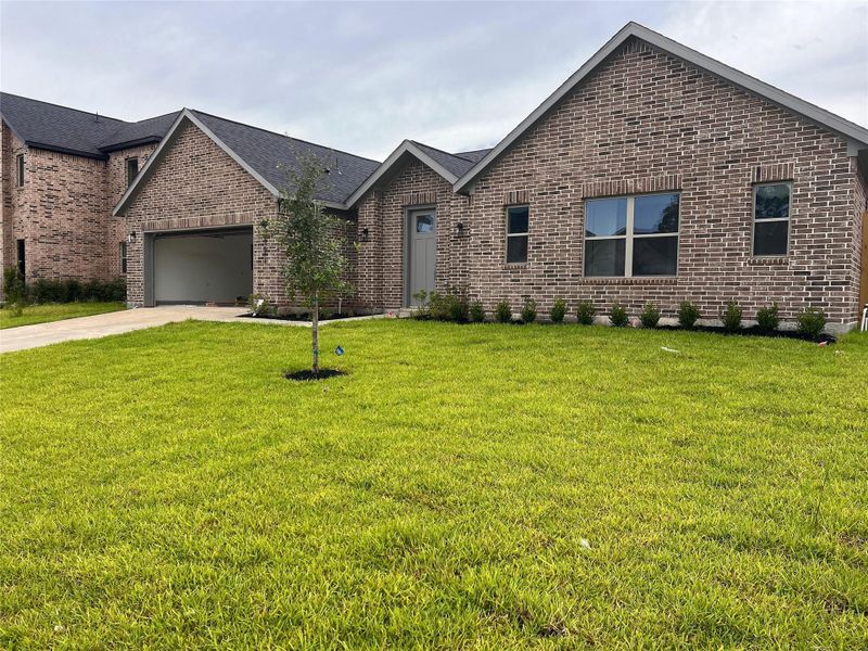 Front exterior of a new home in , Spring, TX, highlighting curb appeal (Image 15). Front exterior of a new home in , Spring, TX, highlighting curb appeal (Image 15).