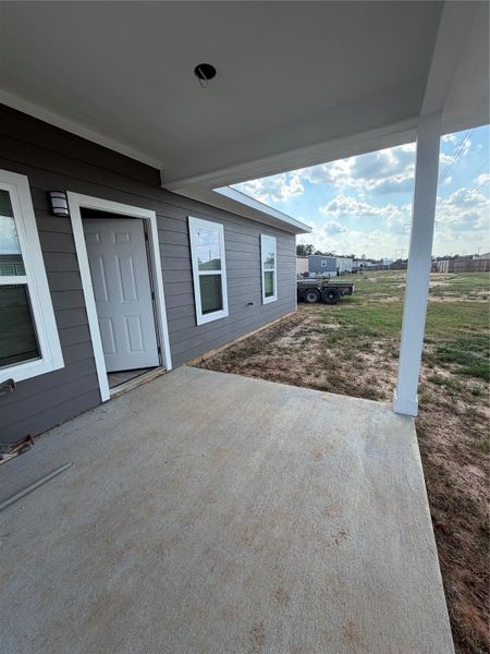 Exterior details and patio area of a home in , Conroe (Image 3).