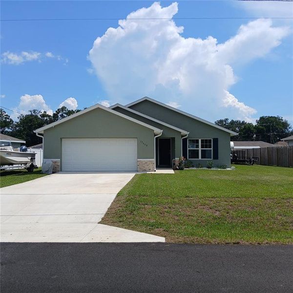 Front exterior of a new home in , Dunnellon, FL, highlighting curb appeal (Image 25).