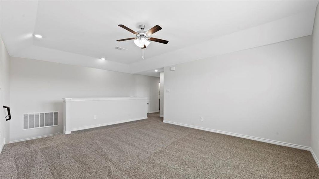 Carpeted empty room featuring recessed lighting and a ceiling fan Carpeted empty room featuring recessed lighting and a ceiling fan