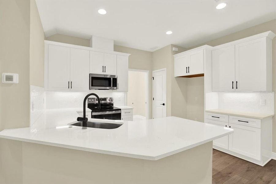 Furnished interior view inside a new home in The Towns At Long Bayou, Seminole (Image 9).