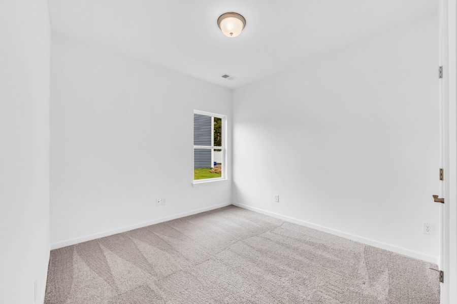 3rd bedroom with window to side yard.