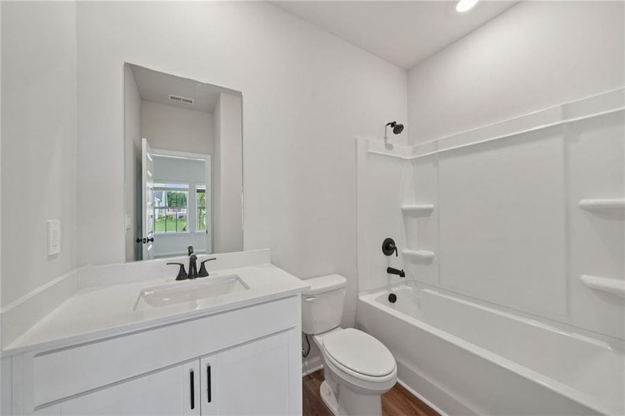 Furnished interior view inside a new home in Vines at Mill Creek - Estate Series, Braselton (Image 13).