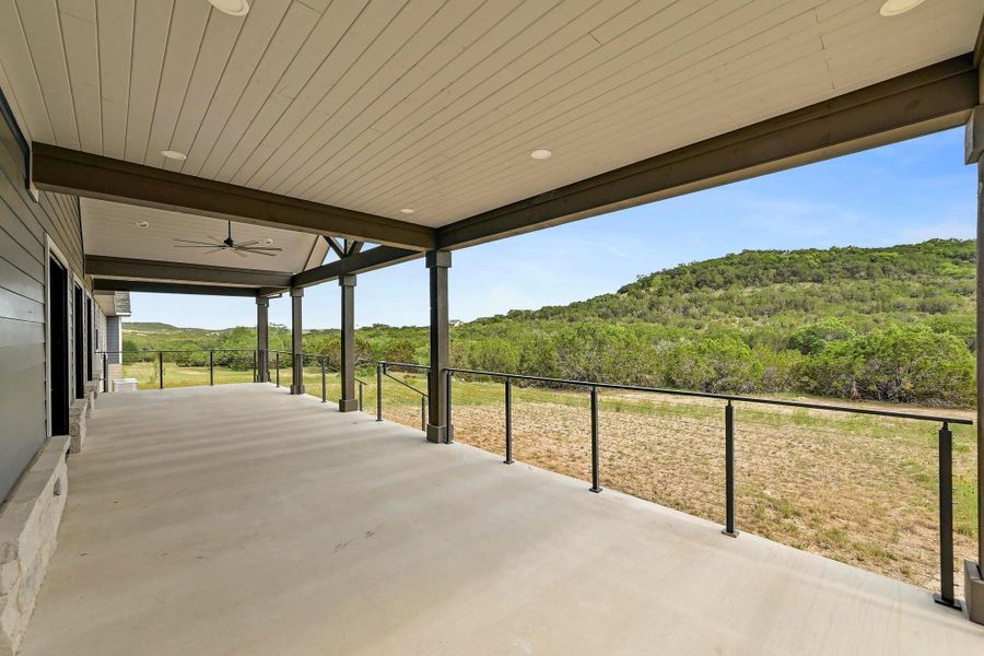 Your living space extends outdoors onto the massive covered back porch where you can relax and entertain with breathtaking hill country views as your backdrop. Your living space extends outdoors onto the massive covered back porch where you can relax and entertain with breathtaking hill country views as your backdrop.