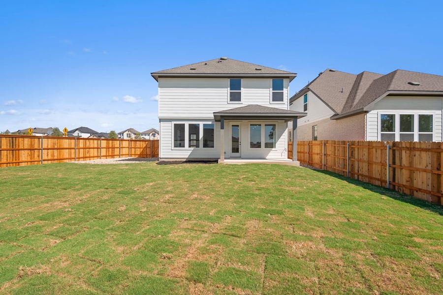 Exterior details and patio area of a home in Terrace Collection at Heritage, Dripping Springs (Image 25).