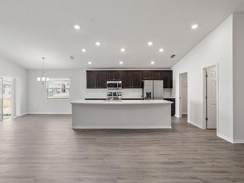 Dine at the island, or the adjacent sunny dining cafe - Remy by Highland Homes Dine at the island, or the adjacent sunny dining cafe - Remy by Highland Homes