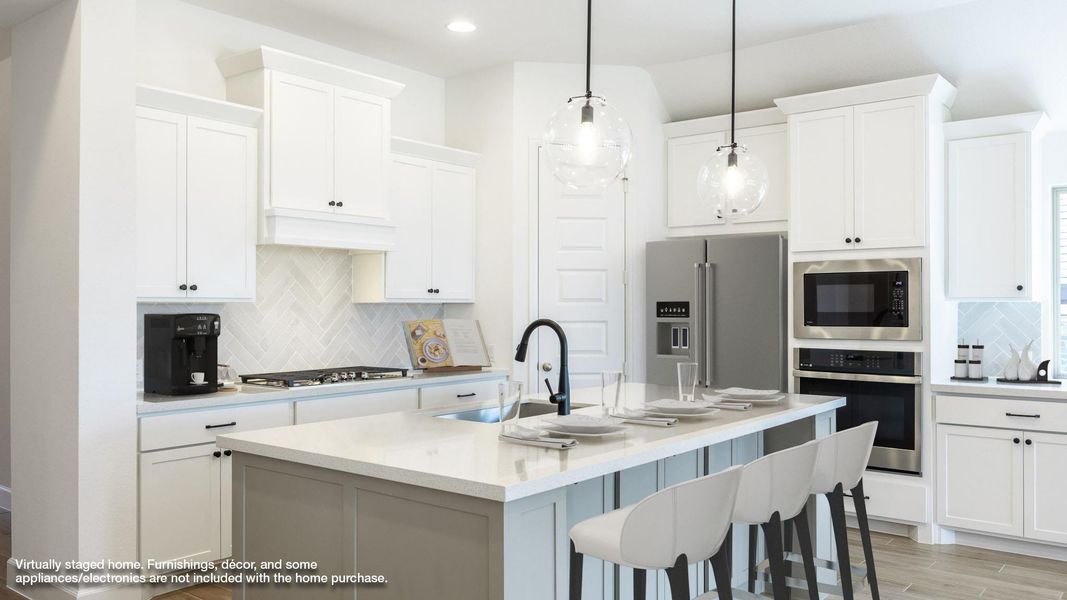 Kitchen with backsplash, stainless steel appliances, a kitchen bar, light wood-style flooring, and recessed lighting