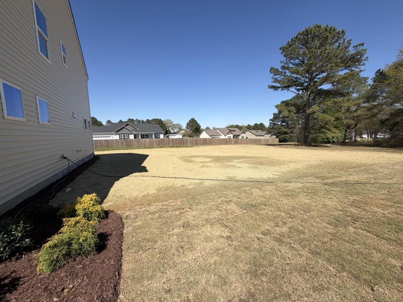 Exterior details and patio area of a home in Black Forest Pointe, Benson (Image 3).