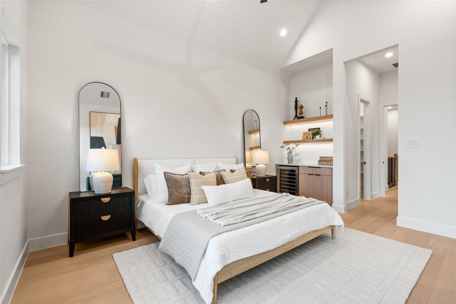 Primary bedroom features soaring cathedral ceilings, two separate large walk-in closets, and a drybar. Primary bedroom features soaring cathedral ceilings, two separate large walk-in closets, and a drybar.