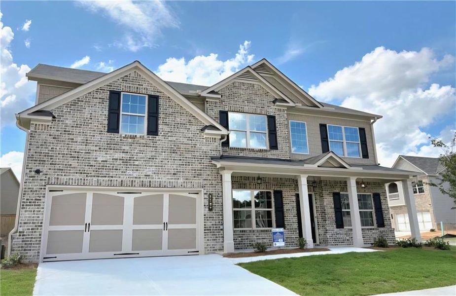 Front exterior of a new home in , Loganville, GA, highlighting curb appeal (Image 19).