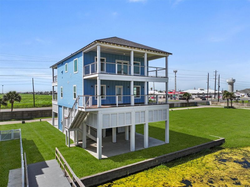 Front exterior of a new home in , Jamaica Beach, TX, highlighting curb appeal (Image 1). Front exterior of a new home in , Jamaica Beach, TX, highlighting curb appeal (Image 1).