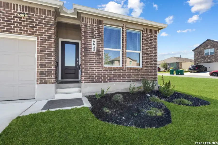 Exterior details and patio area of a home in Hightop Ridge, Converse (Image 4).