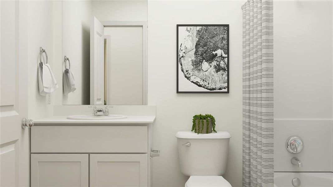 Full bathroom featuring vanity, shower / bath combination with curtain, and toilet