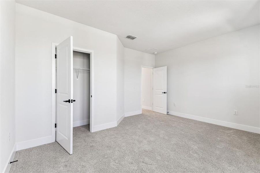 Spacious, unfurnished interior of a new home in Waterset Tradition Series, Apollo Beach (Image 18).