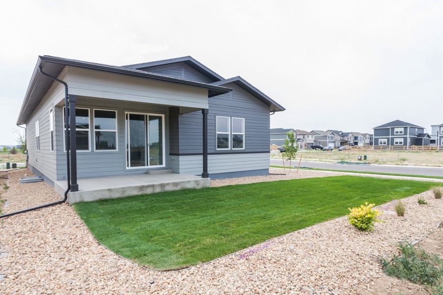 Exterior details and patio area of a home in Prairie Song, Windsor (Image 31).
