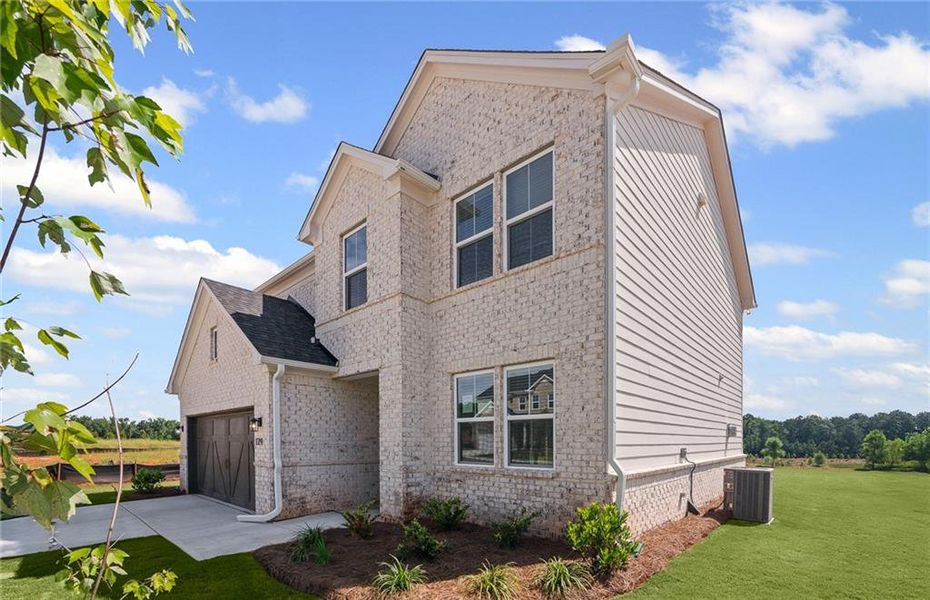 Front exterior of a new home in Overland, Locust Grove, GA, highlighting curb appeal (Image 20).