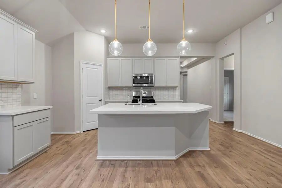 Furnished interior view inside a new home in Bridgeland, Cypress (Image 11).