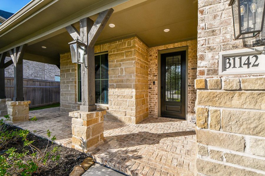Just enough sun and just enough shade bathe your generous front porch in natural light; with ample room for seasonal pieces --- maybe a rocker or two --- and fun garden accents. Just enough sun and just enough shade bathe your generous front porch in natural light; with ample room for seasonal pieces --- maybe a rocker or two --- and fun garden accents.