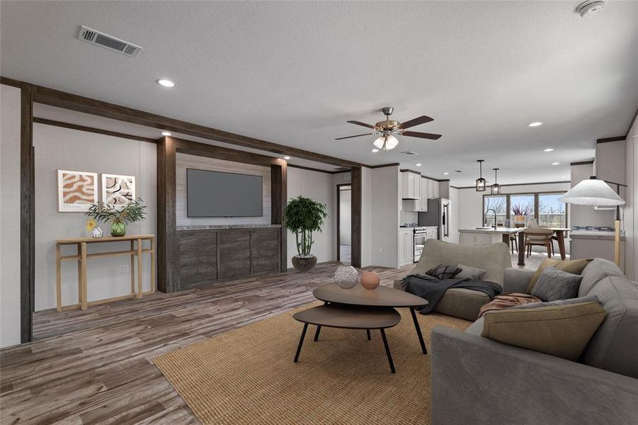 Living area featuring a ceiling fan, wood finished floors, and recessed lighting