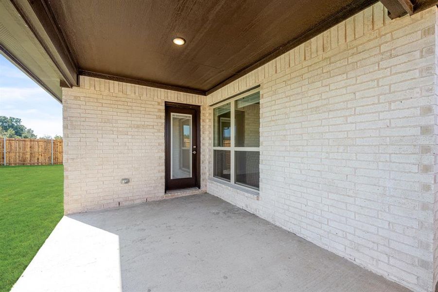 Exterior details and patio area of a home in East Oak Creek 60-65, Commerce (Image 3).