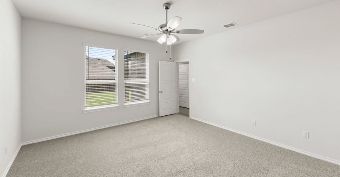 Representative exterior photo of a completed home built from the Raleigh by Impression Homes in Baker Farms, Cleburne, TX (Image 10).