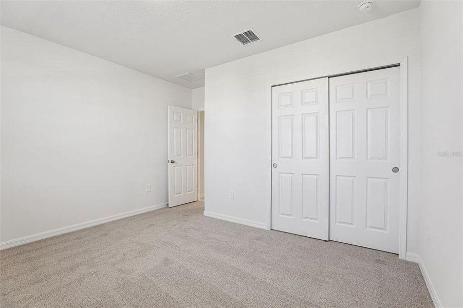 Spacious, unfurnished interior of a new home in Lake Deer Estates - Signature Series, Poinciana (Image 19).