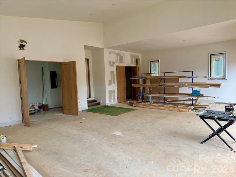 3 car garage with vaulted ceiling for potential car lift. 2 separate storage rooms