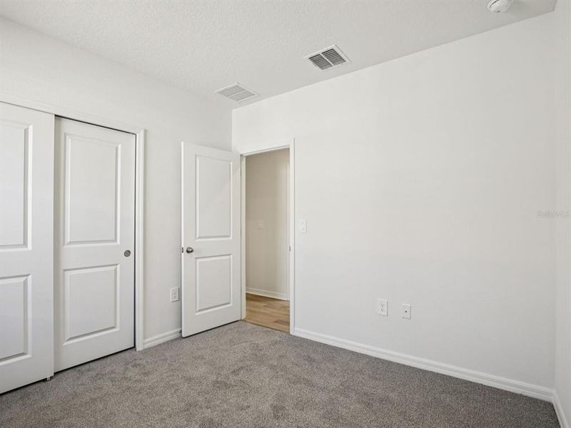 Spacious, unfurnished interior of a new home in Oakfield Trails - Premier Series, Parrish (Image 14).