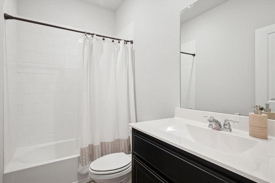 Full bath featuring shower / tub combo and vanity. Full bath featuring shower / tub combo and vanity.