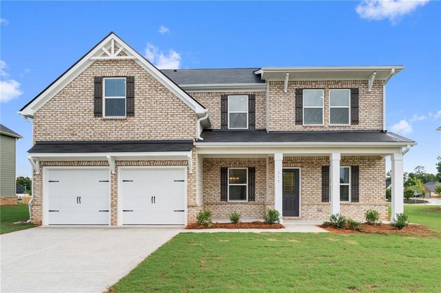 Front exterior of a new home in Southern Hills, McDonough, GA, highlighting curb appeal (Image 1). Front exterior of a new home in Southern Hills, McDonough, GA, highlighting curb appeal (Image 1).