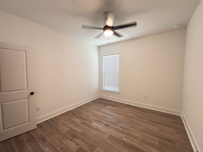 Spacious, unfurnished interior of a new home in Bird Song at Hammock Bay, Freeport (Image 24).