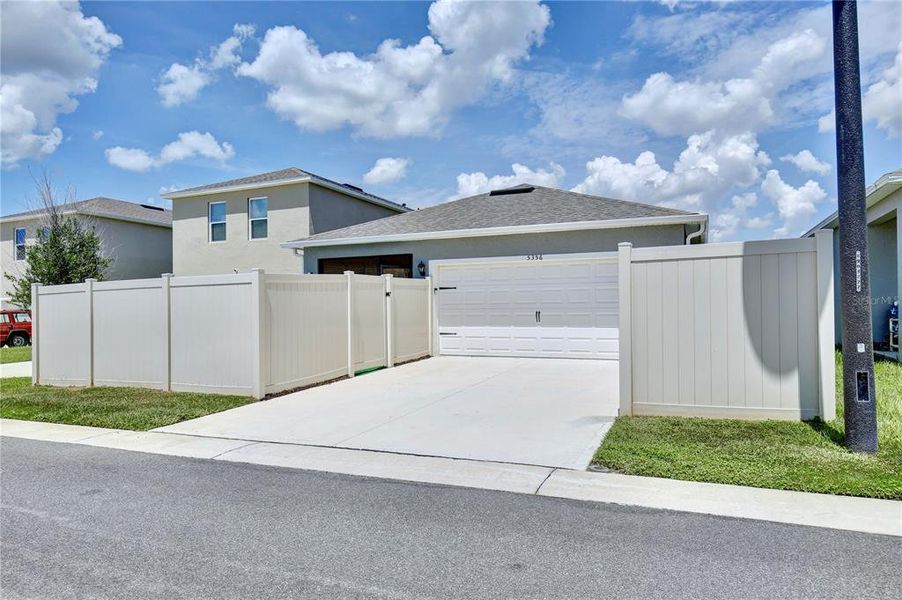 Front exterior of a new home in Windrose, Apopka, FL, highlighting curb appeal (Image 22).