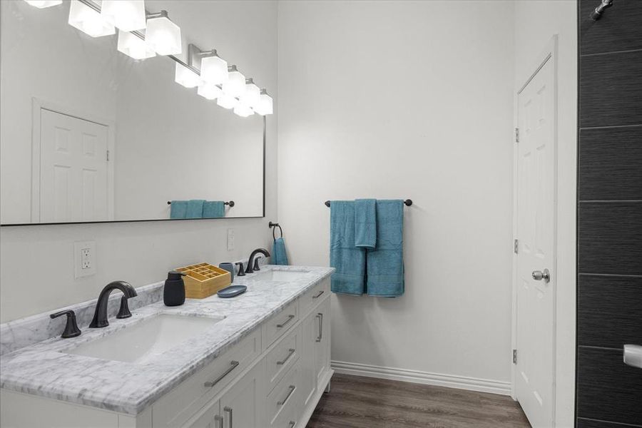 Bathroom with vanity and hardwood / wood-style floors